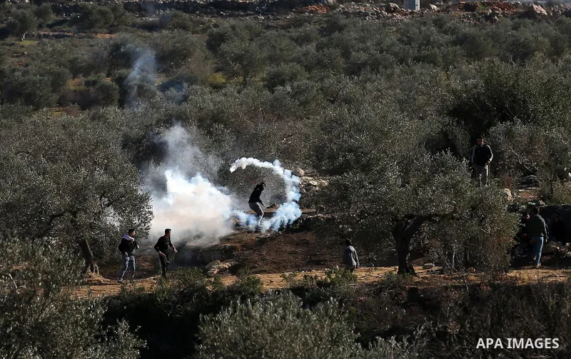 Palestinian protesters clash with Israeli security forces following a demonstration against settlements in the village of Beita in the West Bank, on January 7, 2022. Photo by Wajed Nobani