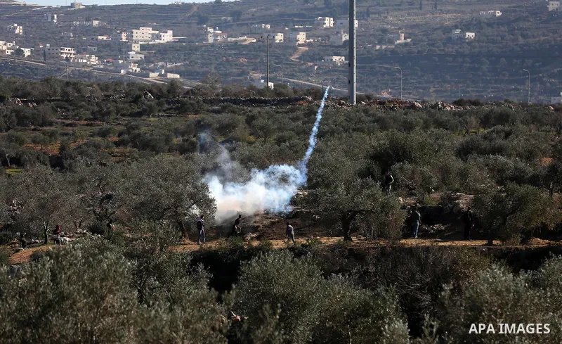 Palestinian protesters clash with Israeli security forces following a demonstration against settlements in the village of Beita in the West Bank, on January 7, 2022. Photo by Wajed Nobani