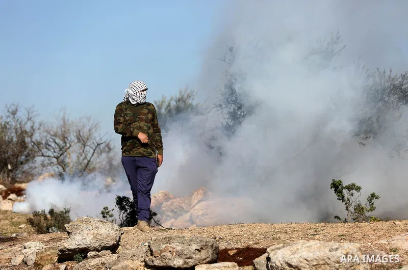 Palestinian protesters clash with Israeli security forces following a demonstration against settlements in the village of Beita in the West Bank, on January 7, 2022. Photo by Wajed Nobani