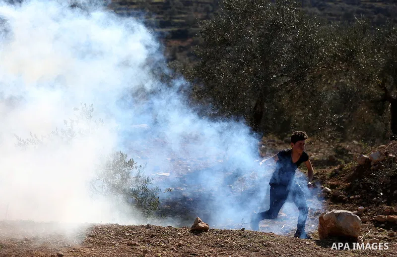 Palestinian protesters clash with Israeli security forces following a demonstration against settlements in the village of Beita in the West Bank, on January 7, 2022. Photo by Wajed Nobani