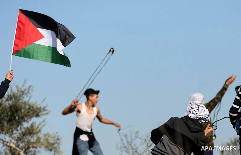 Palestinian protesters clash with Israeli security forces following a demonstration against settlements in the village of Beita in the West Bank, on January 7, 2022. Photo by Wajed Nobani