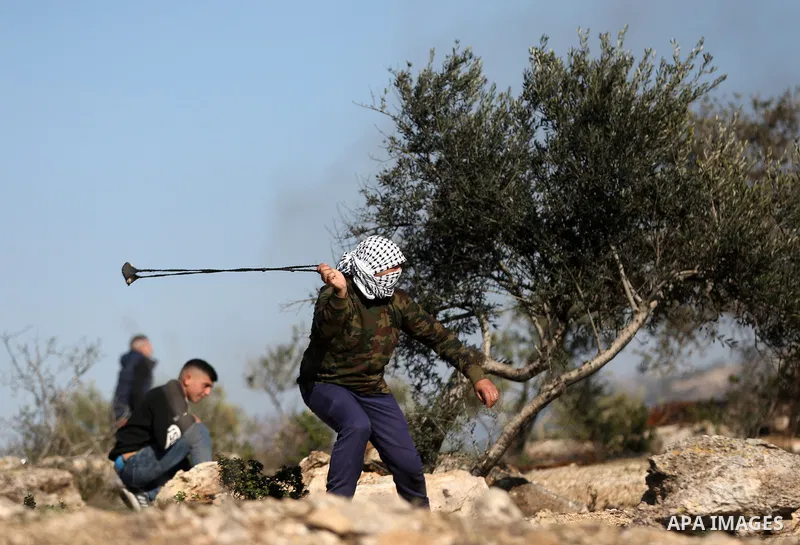 Palestinian protesters clash with Israeli security forces following a demonstration against settlements in the village of Beita in the West Bank, on January 7, 2022. Photo by Wajed Nobani