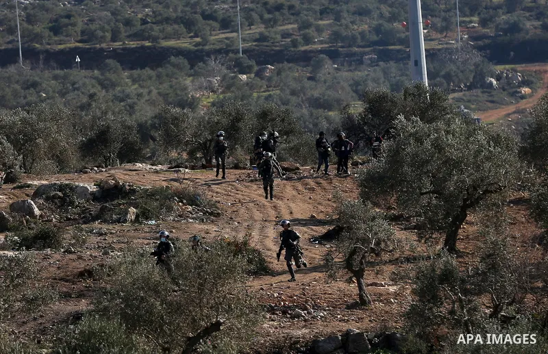 Palestinian protesters clash with Israeli security forces following a demonstration against settlements in the village of Beita in the West Bank, on January 7, 2022. Photo by Wajed Nobani