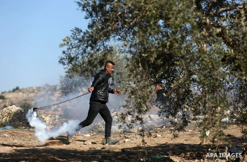 Palestinian protesters clash with Israeli security forces following a demonstration against settlements in the village of Beita in the West Bank, on January 7, 2022. Photo by Wajed Nobani