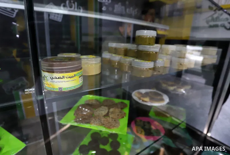 Palestinian chef Hana Al-Wakeel cooks healthy food at healthy home store ​in Gaza city on January 11, 2022. Al-Wakeel cooks healthy food by using healthy materials for low calories. She named the project (Healthy Home) t...