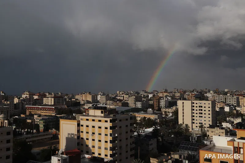 This picture taken on January 19, 2022 shows a view of a rainbow in the sky above Gaza city during a winter storm. Photo by Omar Ashtawy