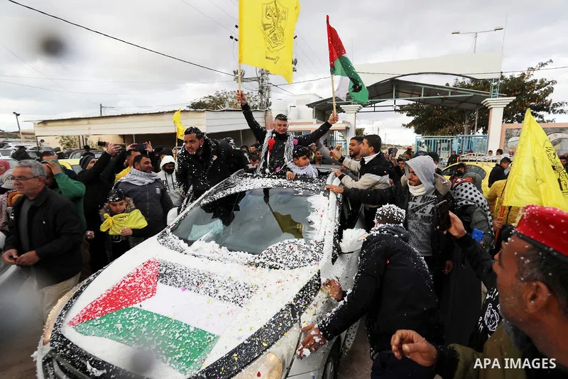 Palestinian freed prisoner Nashat Abu Rock, 41, greets his relatives after released following spend 5 year Israeli jails, in front of Erez crossing in Beit Hanoun in the northern Gaza Strip, on January 20, 2022. Photo by...
