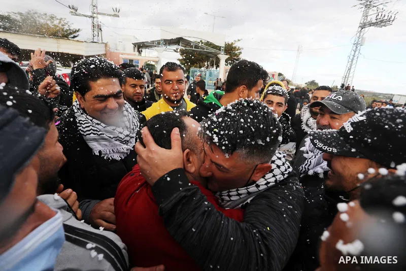 Palestinian freed prisoner Nashat Abu Rock, 41, greets his relatives after released following spend 5 year Israeli jails, in front of Erez crossing in Beit Hanoun in the northern Gaza Strip, on January 20, 2022. Photo by...