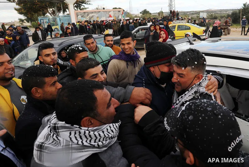 Palestinian freed prisoner Nashat Abu Rock, 41, greets his relatives after released following spend 5 year Israeli jails, in front of Erez crossing in Beit Hanoun in the northern Gaza Strip, on January 20, 2022. Photo by...
