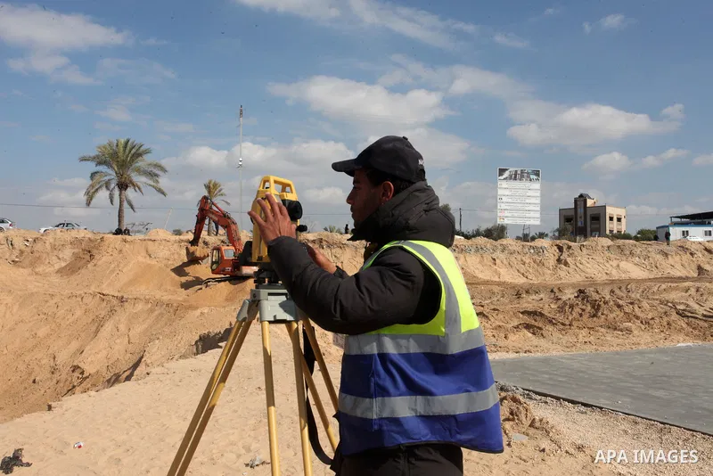 Egyptian machinery work at the construction site of a new housing complex in Beit Lahia in the northern Gaza Strip on January 23, 2022. Gaza officials estimate that it will take $479 million to rebuild homes and infrastr...