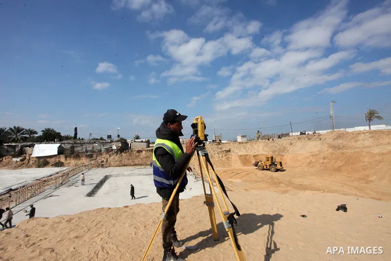 Egyptian machinery work at the construction site of a new housing complex in Beit Lahia in the northern Gaza Strip on January 23, 2022. Gaza officials estimate that it will take $479 million to rebuild homes and infrastr...