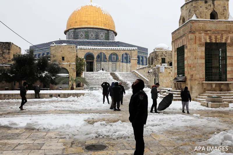 A view shows snow-covered the Dome of the Rock, in Al-Aqsa mousque compound in Jerusalem's Old City following overnight snowfall, on January 27, 2022. Winter storm 'Elpis' hit the region bringing cold temperatures and sn...