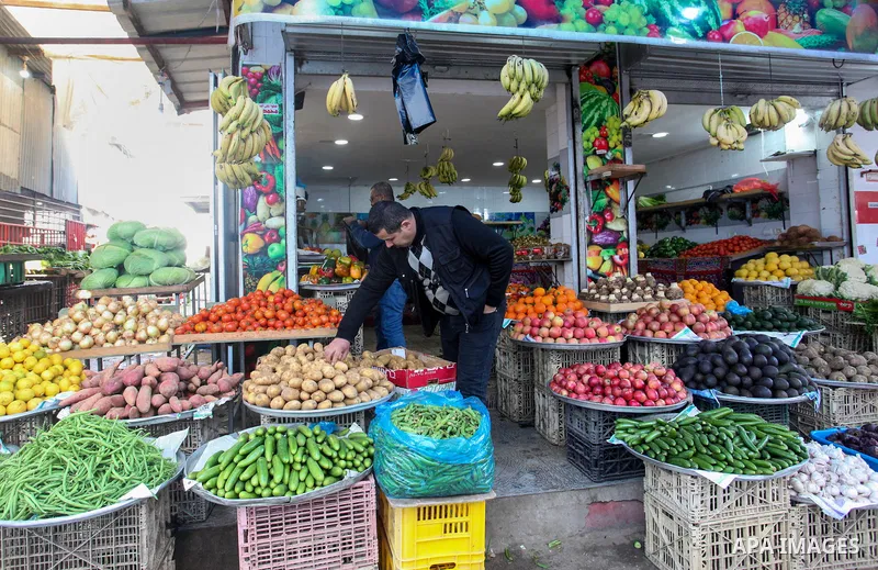 Palestinian sellers display their goods at al-Zawiya Market, in Gaza City on January 30 , 2022. The Gaza Strip is witnessing a marked increase in the prices of fruits and vegetables. Photo by Rahaf Aziz