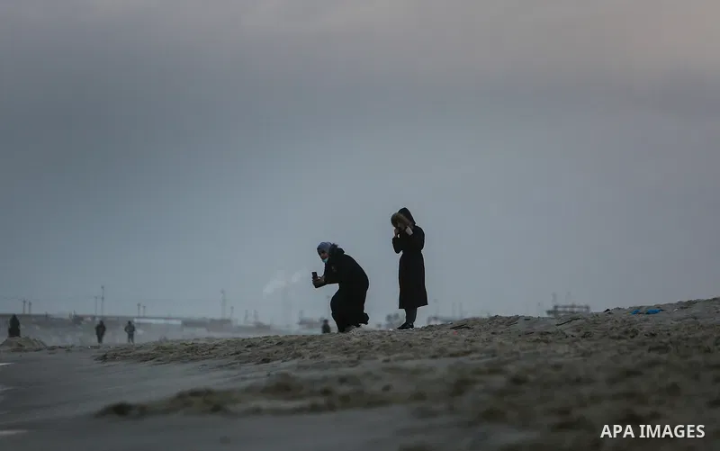 Palestinians enjoy on the beach of Gaza city on January 31, 2022. The beach is one of the few open public spaces in this densely populated city. Now a ceaseless conflict that seems to impinge on nearly every aspect of li...