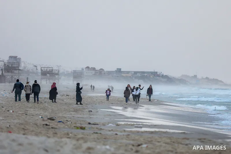 Palestinians enjoy on the beach of Gaza city on January 31, 2022. The beach is one of the few open public spaces in this densely populated city. Now a ceaseless conflict that seems to impinge on nearly every aspect of li...