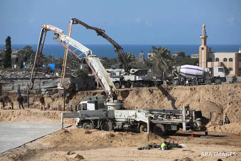 Palestinian, Egyptian workers and bulldozers make ground for the Egyptian-funded housing project "Dar Misr 3" in Beita lahia in the northern of Gaza Strip on February 1, 2022. Today, the mechanisms and equipment began to...