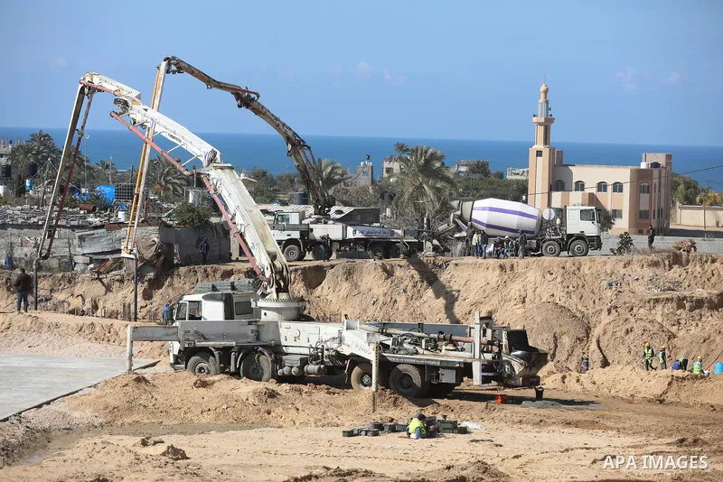 Palestinian, Egyptian workers and bulldozers make ground for the Egyptian-funded housing project "Dar Misr 3" in Beita lahia in the northern of Gaza Strip on February 1, 2022. Today, the mechanisms and equipment began to...