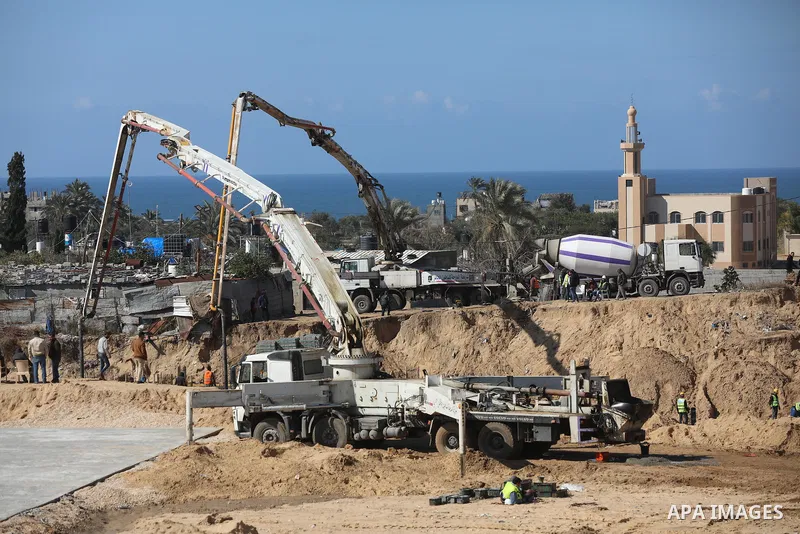 Palestinian, Egyptian workers and bulldozers make ground for the Egyptian-funded housing project "Dar Misr 3" in Beita lahia in the northern of Gaza Strip on February 1, 2022. Today, the mechanisms and equipment began to...