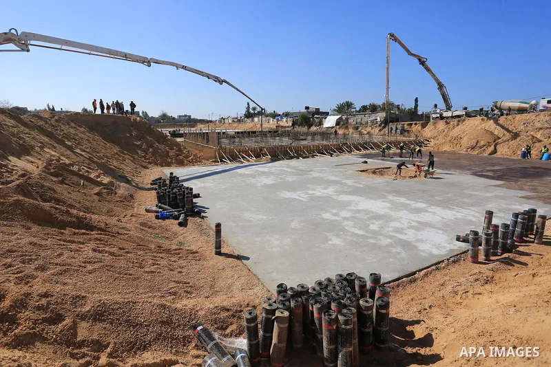 Palestinian, Egyptian workers and bulldozers make ground for the Egyptian-funded housing project "Dar Misr 3" in Beita lahia in the northern of Gaza Strip on February 1, 2022. Today, the mechanisms and equipment began to...
