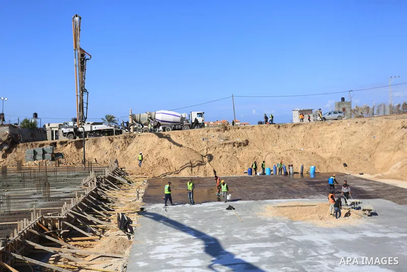 Palestinian, Egyptian workers and bulldozers make ground for the Egyptian-funded housing project "Dar Misr 3" in Beita lahia in the northern of Gaza Strip on February 1, 2022. Today, the mechanisms and equipment began to...
