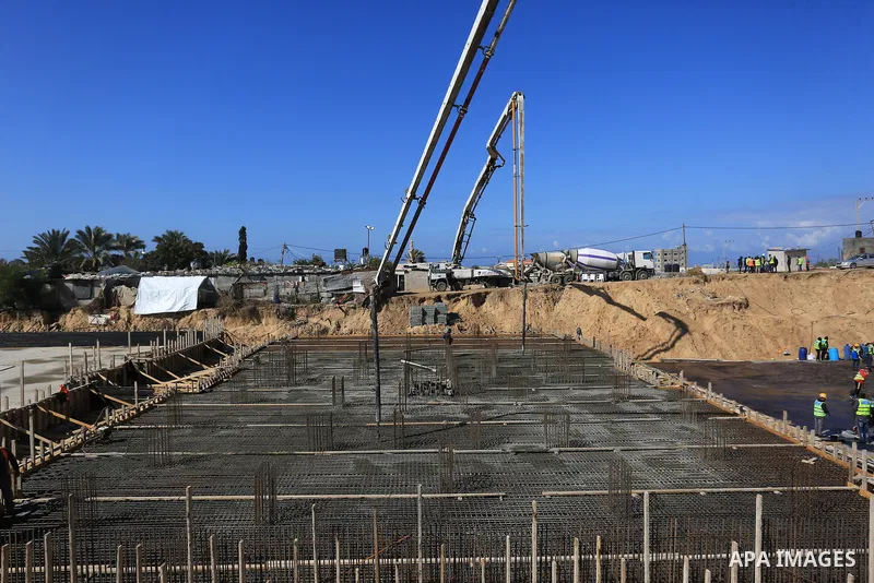 Palestinian, Egyptian workers and bulldozers make ground for the Egyptian-funded housing project "Dar Misr 3" in Beita lahia in the northern of Gaza Strip on February 1, 2022. Today, the mechanisms and equipment began to...