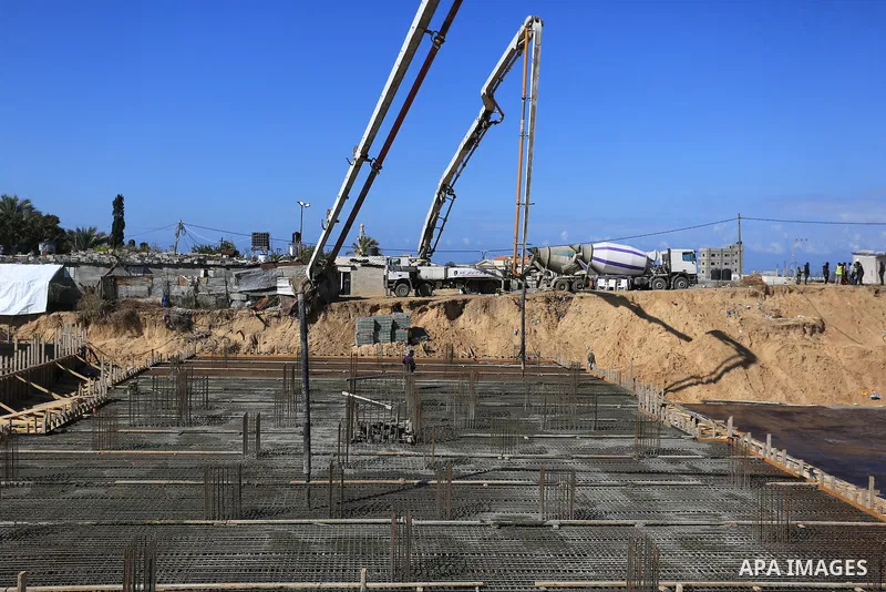 Palestinian, Egyptian workers and bulldozers make ground for the Egyptian-funded housing project "Dar Misr 3" in Beita lahia in the northern of Gaza Strip on February 1, 2022. Today, the mechanisms and equipment began to...