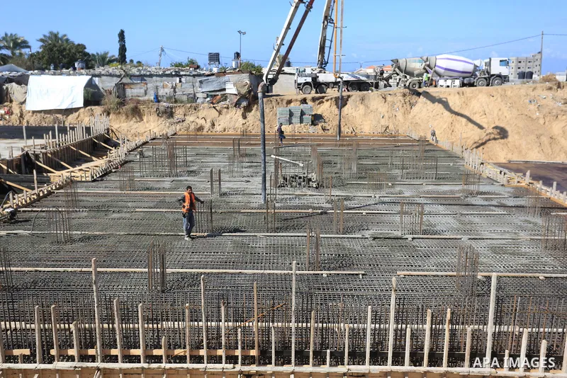 Palestinian, Egyptian workers and bulldozers make ground for the Egyptian-funded housing project "Dar Misr 3" in Beita lahia in the northern of Gaza Strip on February 1, 2022. Today, the mechanisms and equipment began to...