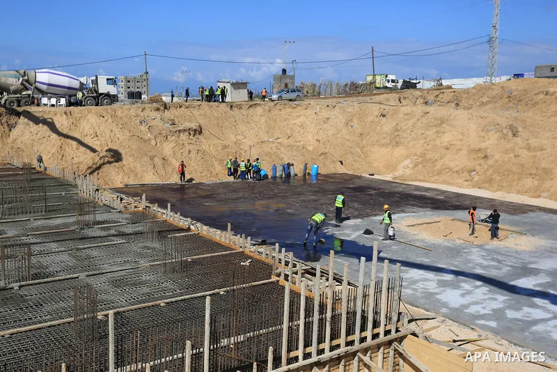Palestinian, Egyptian workers and bulldozers make ground for the Egyptian-funded housing project "Dar Misr 3" in Beita lahia in the northern of Gaza Strip on February 1, 2022. Today, the mechanisms and equipment began to...