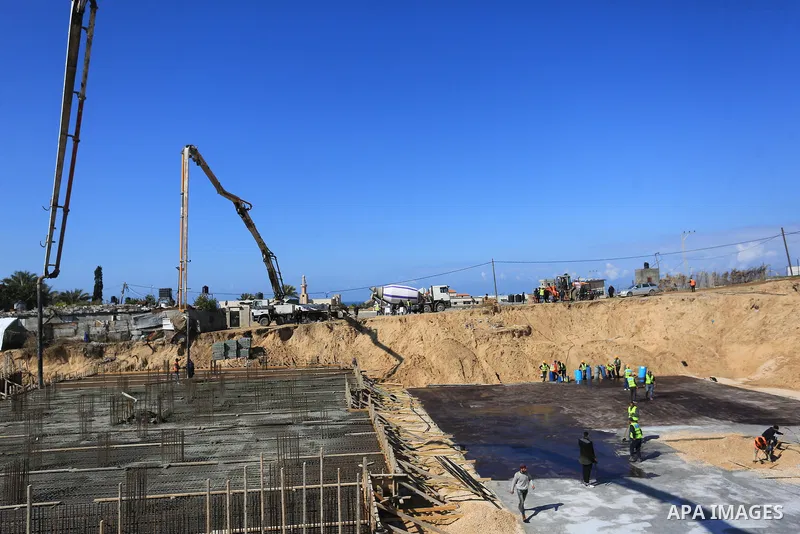 Palestinian, Egyptian workers and bulldozers make ground for the Egyptian-funded housing project "Dar Misr 3" in Beita lahia in the northern of Gaza Strip on February 1, 2022. Today, the mechanisms and equipment began to...