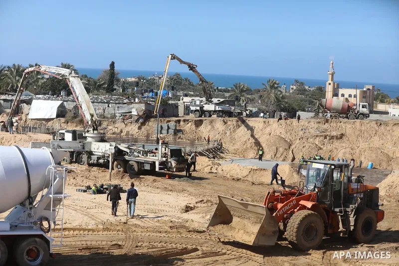 Palestinian, Egyptian workers and bulldozers make ground for the Egyptian-funded housing project "Dar Misr 3" in Beita lahia in the northern of Gaza Strip on February 1, 2022. Today, the mechanisms and equipment began to...