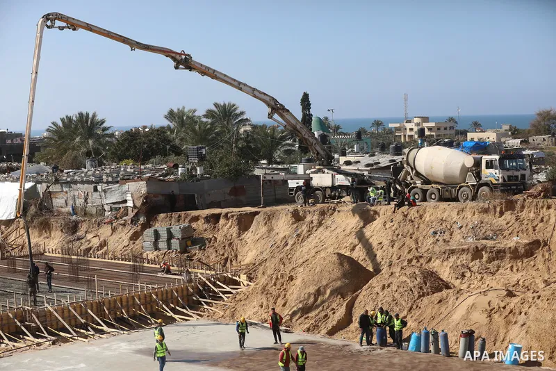 Palestinian, Egyptian workers and bulldozers make ground for the Egyptian-funded housing project "Dar Misr 3" in Beita lahia in the northern of Gaza Strip on February 1, 2022. Today, the mechanisms and equipment began to...