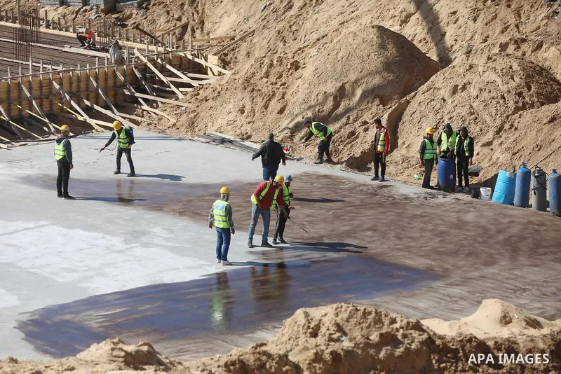Palestinian, Egyptian workers and bulldozers make ground for the Egyptian-funded housing project "Dar Misr 3" in Beita lahia in the northern of Gaza Strip on February 1, 2022. Today, the mechanisms and equipment began to...