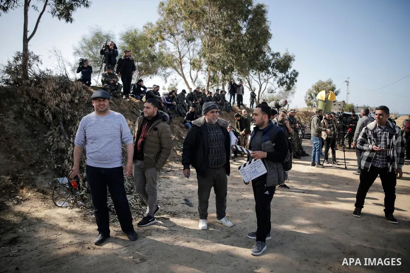 Palestinian actors and crew shoot a scene of the series "Qabdat al-Ahrar," meaning "Fist of the Free" in Arabic, in Beit Lahia in the northern of Gaza Strip on Feb. 03, 2022. In Gaza Strip, an impoverished Palestinian te...