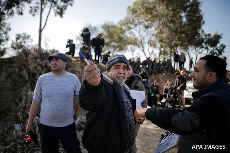Palestinian actors and crew shoot a scene of the series "Qabdat al-Ahrar," meaning "Fist of the Free" in Arabic, in Beit Lahia in the northern of Gaza Strip on Feb. 03, 2022. In Gaza Strip, an impoverished Palestinian te...