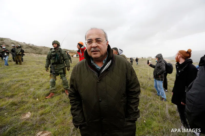 Arab-Israeli Knesset member Ahmed Tibi helps Palestinians to plant olive trees near outpost of Givat Ronen in Burin village, near the West Bank city of Nablus on February 4, 2022. Photo by Shadi Jarar'ah