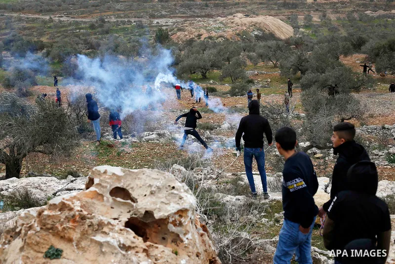 Palestinian protesters clash with Israeli security forces following a demonstration against settlements in the village of Beita in the West Bank, on February 4, 2022. Photo by Shadi Jarar'ah