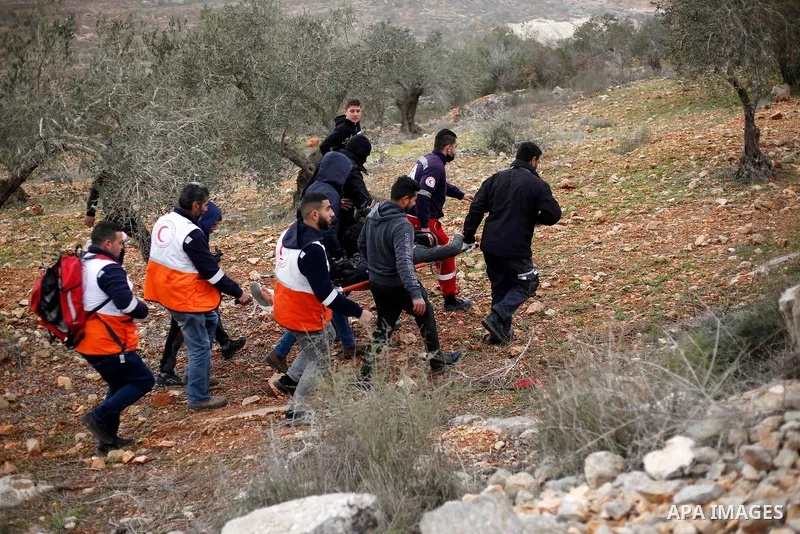Palestinian protesters clash with Israeli security forces following a demonstration against settlements in the village of Beita in the West Bank, on February 4, 2022. Photo by Shadi Jarar'ah