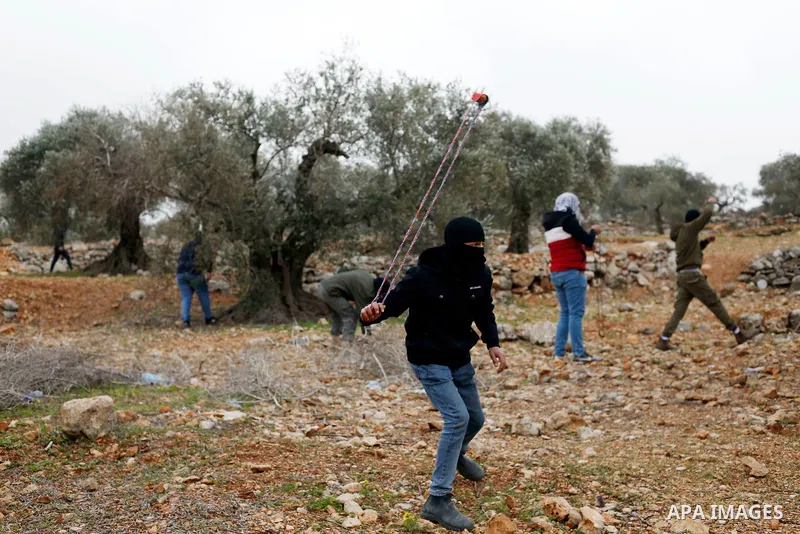Palestinian protesters clash with Israeli security forces following a demonstration against settlements in the village of Beita in the West Bank, on February 4, 2022. Photo by Shadi Jarar'ah