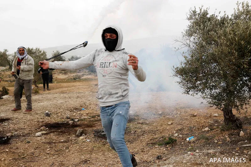 Palestinian protesters clash with Israeli security forces following a demonstration against settlements in the village of Beita in the West Bank, on February 4, 2022. Photo by Shadi Jarar'ah