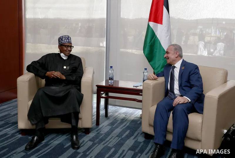 Palestinian Prime Minister Mohammed Ishtayeh meets with Nigerian President Muhammed Buhari during the 35th Ordinary Session of the African Union (AU) Summit in Addis Ababa, Ethiopia on February 05, 2022. Photo by Shadi H...