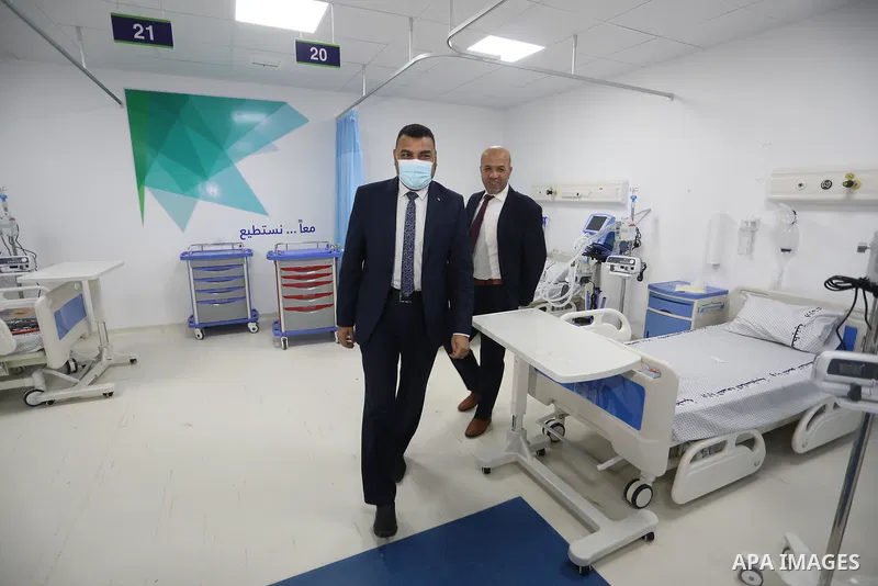 Palestinians attend the opening ceremony of the Emirati field hospital to house coronavirus disease (COVID-19), patients in Khan Younis in the southern of Gaza Strip, February 12, 2022. Covid-19 claimed the life of 13 pe...