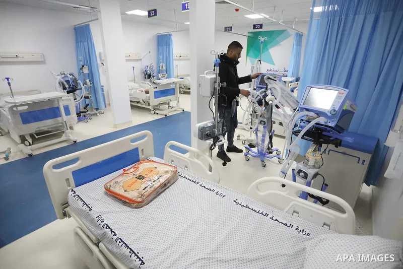 Palestinians attend the opening ceremony of the Emirati field hospital to house coronavirus disease (COVID-19), patients in Khan Younis in the southern of Gaza Strip, February 12, 2022. Covid-19 claimed the life of 13 pe...