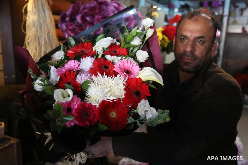 Palestinian vendors display flowers, red teddy bears, and pillows on Valentine's day, in Gaza city on February 14, 2022. Valentine's Day is increasingly popular in the region as people have taken up the custom of giving...