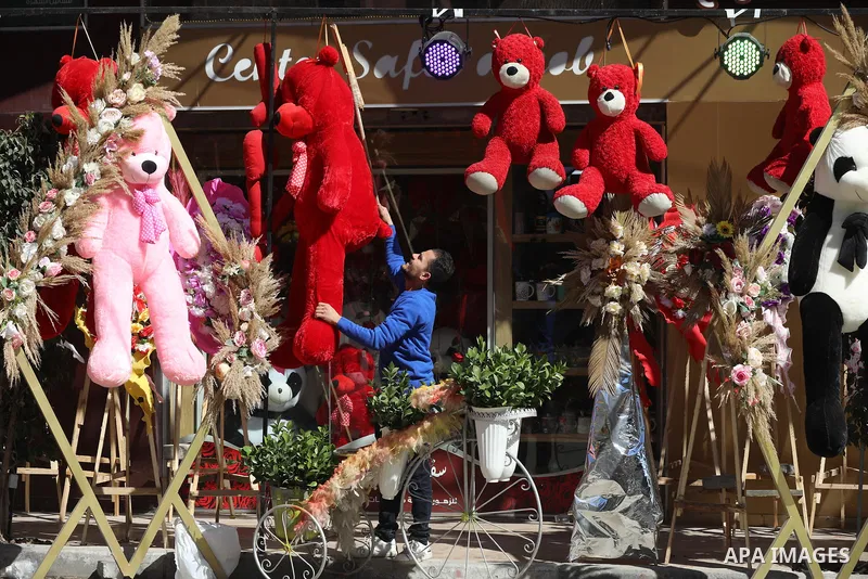 Palestinian vendors display flowers, red teddy bears, and pillows on Valentine's day, in Gaza city on February 14, 2022. Valentine's Day is increasingly popular in the region as people have taken up the custom of giving...