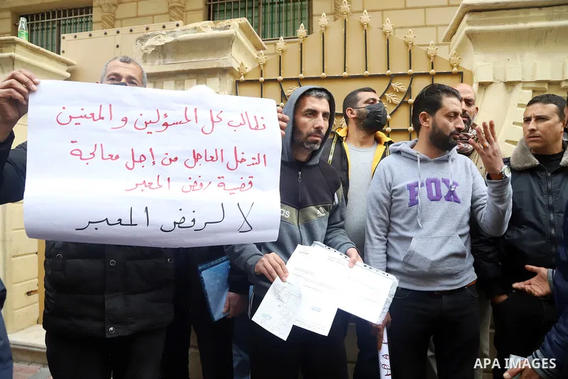 Palestinian workers take part in a protest to demand a new permits to work into Israel in Gaza city on February 20, 2022. Photo by Youssef Abu Watfa
