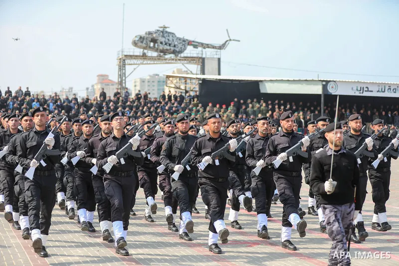 Palestinian policemen take part in a graduation ceremony, in Gaza City on February 21, 2022. Photo by Atia Darwish