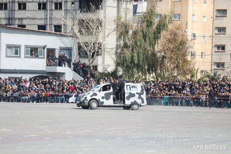 Palestinian policemen take part in a graduation ceremony, in Gaza City on February 21, 2022. Photo by Atia Darwish
