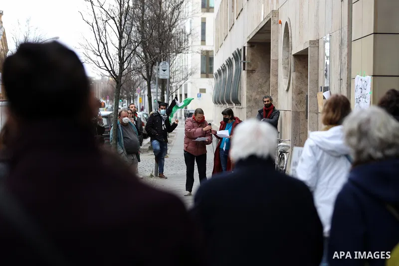 Activists take part in a protest in support of Amnesty International's report which described Israel as an apartheid state because of its treatment of Palestinians, in Berlin, Germany on Feb. 23, 2022. Amnesty Internatio...