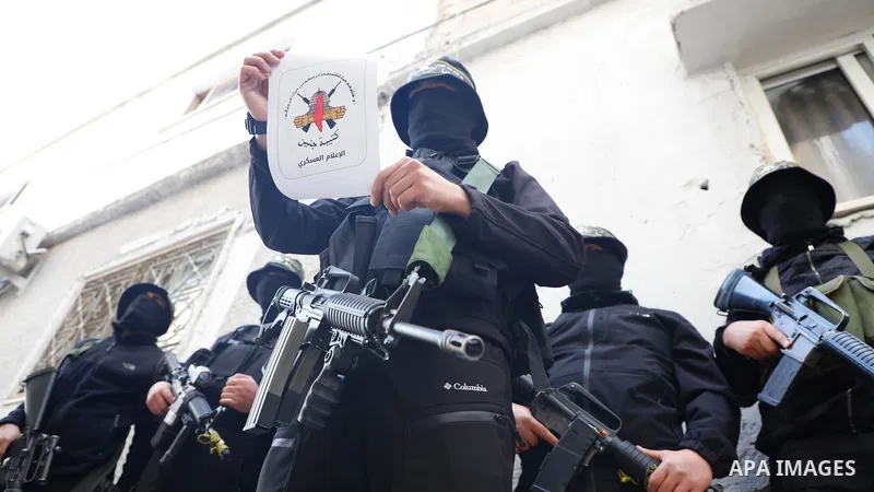 Palestinian militants from the Al-Quds Brigades, the armed wing of the Islamic Jihad movement "Jenin Brigade" take part in a press confernce, in the northern West Bank refugee camp of Jenin on March 01 2022. Israeli forc...
