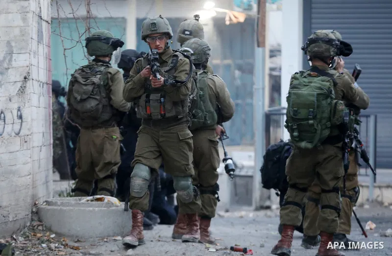 Clashes between Palestinian protesters and Israeli forces following the funeral of Ammar Abu Afifa who was killed by Israeli troops at the al-Arroub refugee camp in the West Bank city of Hebron on March 2, 2022. Photo by...